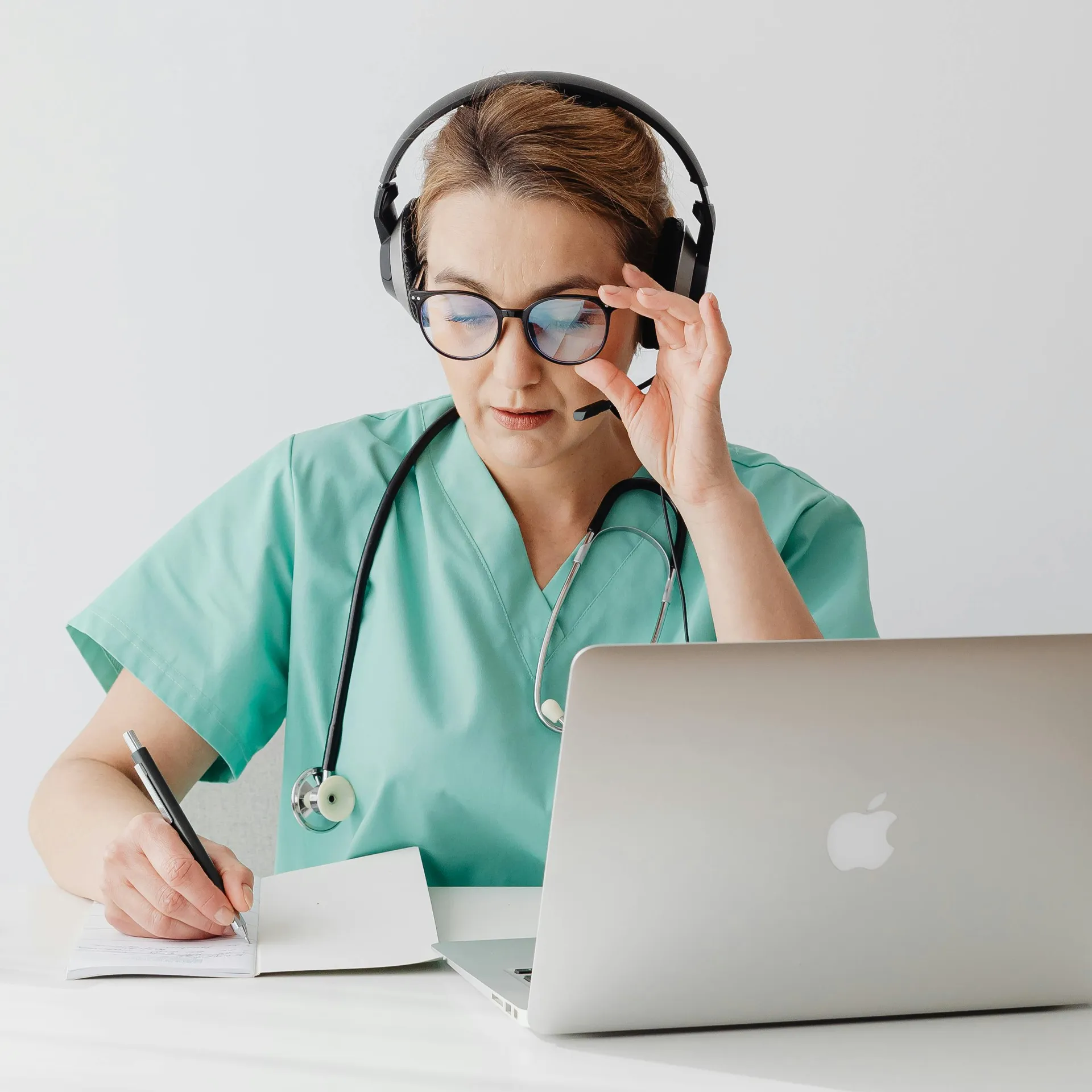 Doctor with tablet reviewing patient information