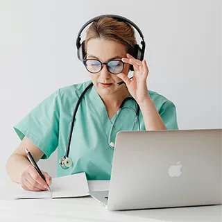Doctor with tablet reviewing patient information