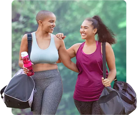 Two women walking outside after a workout