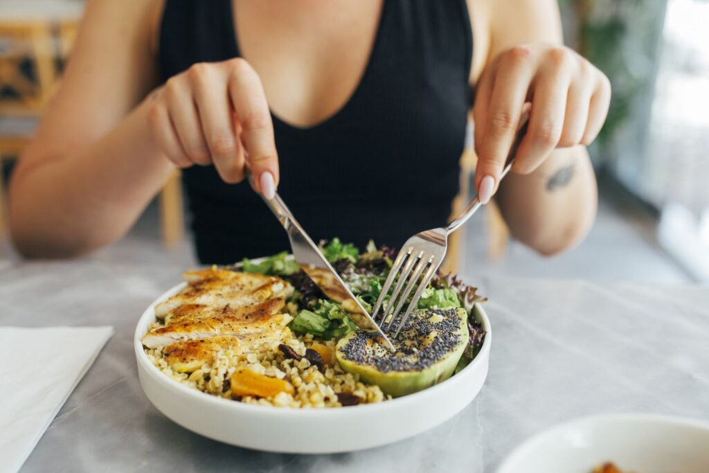 woman eating a protein meal